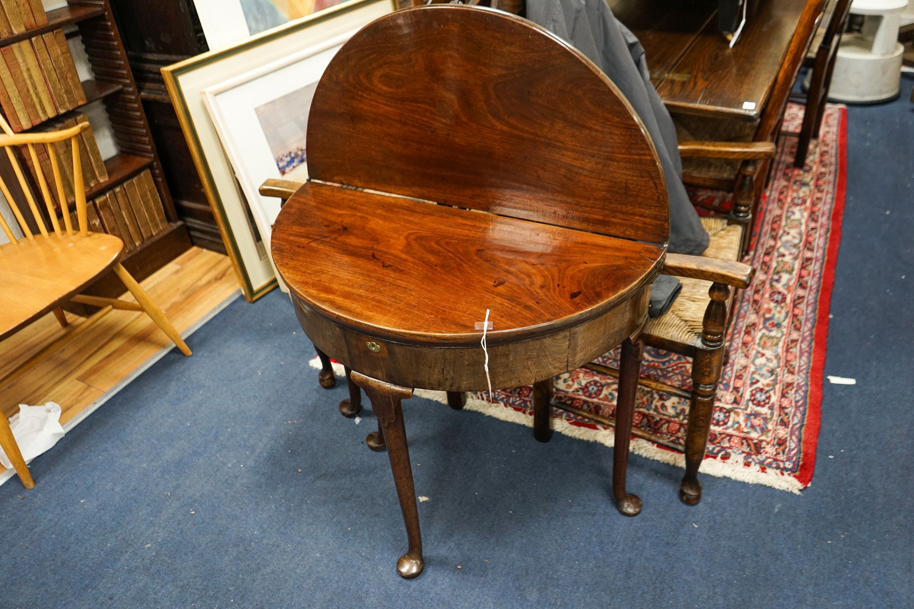 A George III mahogany demi lune folding tea table, width 97cm, depth 39cm, height 71cm